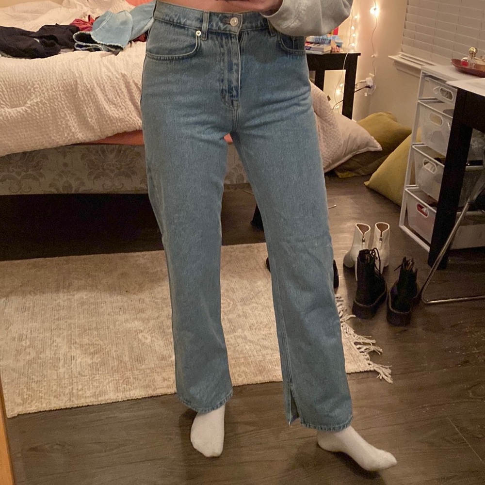 Medium/light wash split hem jeans